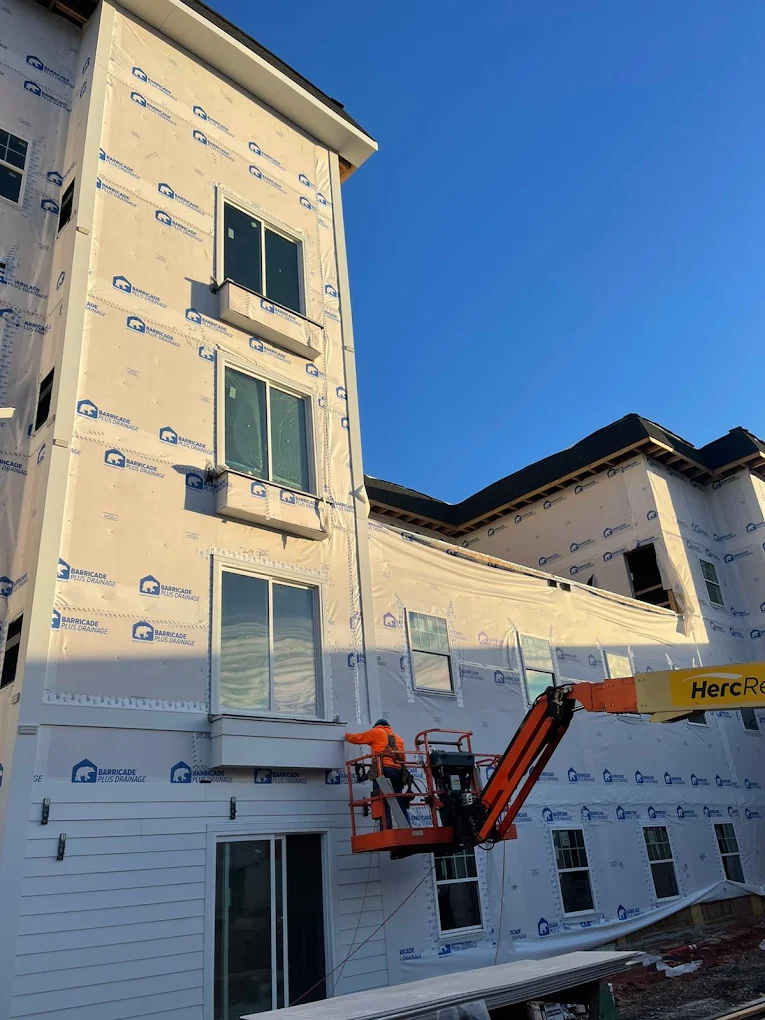 Siding installation on multifamily building
